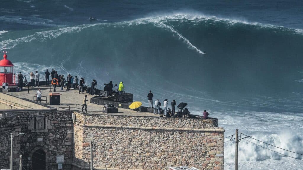 An image of a person surfing the record breaking wave in Nazaré