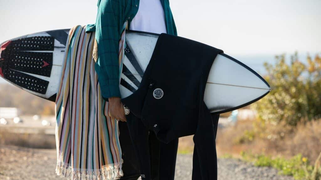 An image of a surfboard and a wetsuit