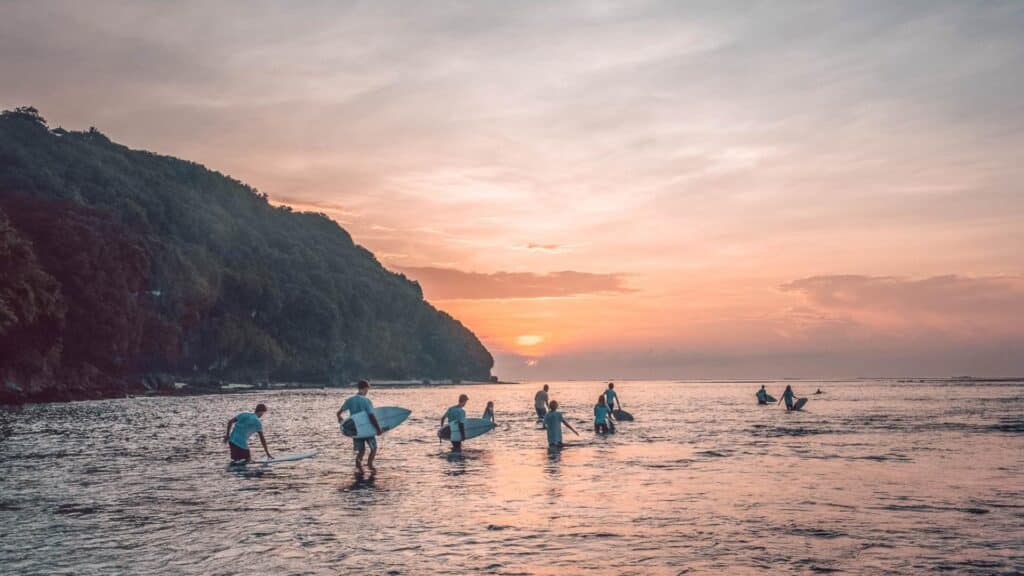 An image of surfers in the sea in Bali
